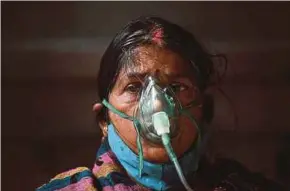  ?? PIC AFP ?? A patient breathing with the help of oxygen provided by a gurdwara amid a devastatin­g Covid-19 pandemic in Ghaziabad on Sunday.