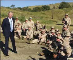  ??  ?? In this Dec. 21 file photo, Defense Secretary Jim Mattis talks to U.S. Marine Corps troops at a rifle range at Guantanamo Bay, Cuba. AP PHOTO/ROBERT BURNS