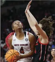  ?? (AP/Nell Redmond) ?? With forward Aliyah Boston (left), South Carolina has ended the regular season atop The Associated Press Top 25 women’s basketball poll. The Gamecocks are the No. 1 seed in the Greenville 1 Region, which also features Maryland, Notre Dame and UCLA.