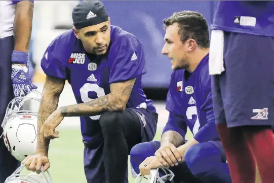  ?? JOHN MAHONEY ?? Johnny Manziel, right, speaks with fellow Alouettes QB Vernon Adams during practice this week. Adams took the majority of reps with the starting offence at Tuesday’s practice.