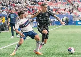  ?? Rich Lam/Associated Press ?? Defender Franco Escobar, right, will miss the Dynamo’s rematch against LAFC on Wednesday after scoring one of Houston’s four goals in Saturday’s victory.