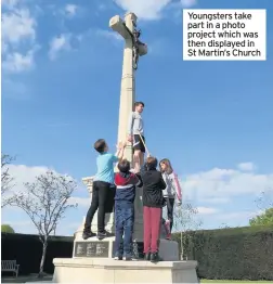  ??  ?? Youngsters take part in a photo project which was then displayed in St Martin’s Church