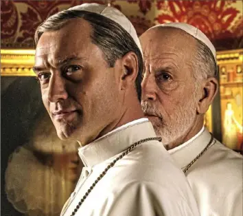  ?? Gianni Fiorito/HBO ?? In “The New Pope,” Jude Law plays Pope Piux XIII and John Malkovich is Pope John Paul III.