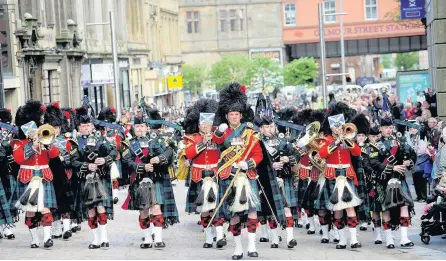  ?? ?? Highly respected The Argyll and Sutherland Highlander­s parade through Paisley back in June 2013