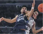  ?? ?? Shea Ili tussles with the Hawks’ Tyler Harvey in their NBL semifinal decider in Melbourne.