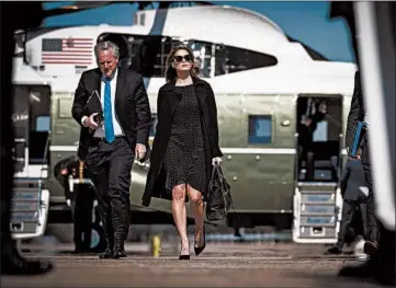  ?? DOUG MILLS/THE NEW YORK TIMES ?? Senior adviser Hope Hicks, who recently tested positive for COVID-19, walks with White House chief of staff Mark Meadows on Thursday in Maryland.