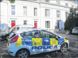  ?? Picture: Martin Apps ?? Defendant John Barham, and police vehicles outside the building in which pensioner John Birney lived. Mr Birney’s body was discovered inside