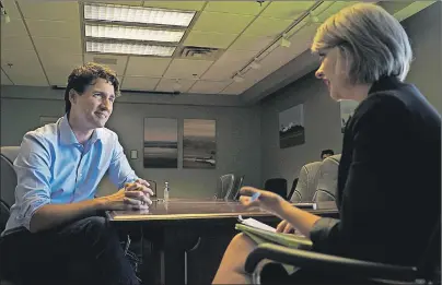  ?? NATHAN ROCHFORD/THE GUARDIAN ?? Prime Minister Justin Trudeau sits down for a one-on-one interview with Guardian reporter Teresa Wright at the Charlottet­own Airport on Thursday. The prime minister defended his decision not to appoint an Atlantic MP to ACOA during his interview.