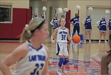  ?? Wes Taylor/Special to News-Times ?? Player of the Year: Parkers Chapel's Ali Looney dribbles the ball up the court in postseason action this basketball season. Looney helped the Lady Trojans to a 20-5 record and was named Sports Alley/News-Times Girls Basketball Player of the Year.