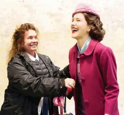  ?? NICOLE RIVELLI/AMAZON ?? Costume designer Donna Zakowska, left, dresses actress Rachel Brosnahan for The Marvelous Mrs. Maisel, using colour to show changes in her character. The comedy-drama, set in the 1950s, follows a housewife who discovers she has what it takes to be a standup comedian.