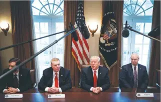  ?? THE NEW YORK TIMES ?? President Donald Trump leads a roundtable discussion on foreign trade and steel production Wednesday with corporate leaders inside the Cabinet Room of the White House in Washington. From left: Roger Newport, chief executive of AK Steel Holding Corp.;...