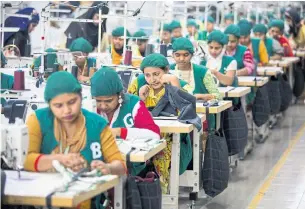  ?? A.M. AHAD/ THE ASSOCIATED PRESS ?? A new survey says that five years after the Rana Plaza collapse in Bangladesh killed about 1,130 people and left thousands injured some things have changed for the better for the workers who toiled in the country's huge garment industry but much...