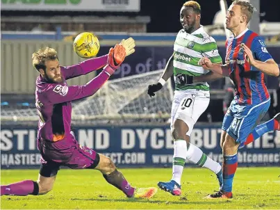  ?? Picture: SNS. ?? Moussa Dembele clips the ball past Owain Fon Williams for his second goal of the night.