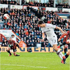  ??  ?? Heading for a draw: Marcos Alonso scores his second goal to salvage a point for Chelsea