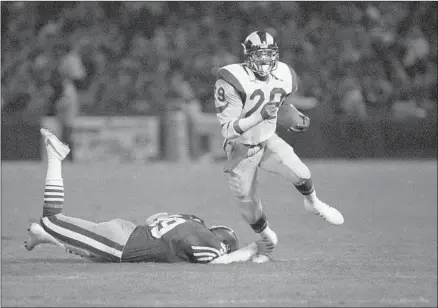  ?? Eric Risberg Associated Press ?? RAMS great Eric Dickerson was incredulou­s before his Candlestic­k Park debut when coach John Robinson told him about the 49ers fans. Then he played his first game there in 1984. “They were throwing stuff at us,” he says. “They were like a bunch of gangsters.”