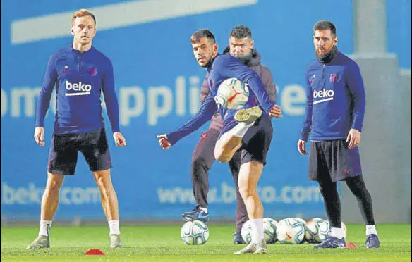  ?? REUTERS ?? (From left) Barcelona's Ivan Rakitic, Carles Perez and Lionel Messi during a training session at Camp Nou ahead of Wednesday’s El Clasico.