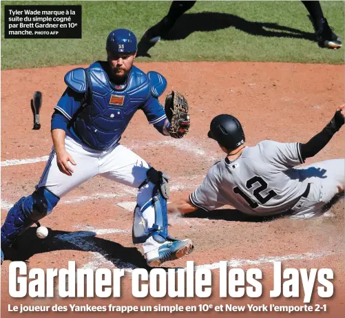  ?? PHOTO AFP ?? Tyler Wade marque à la suite du simple cogné par Brett Gardner en 10e manche.