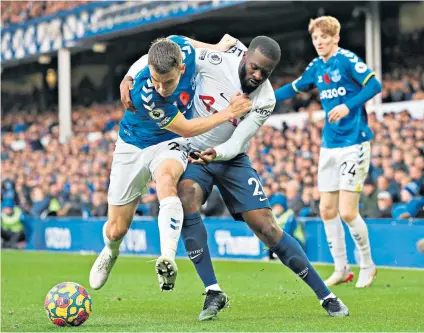  ?? ?? Enigma: Getting the best out of Tanguy Ndombele, pictured tussling with Everton’s Seamus Coleman, has taxed Tottenham managers