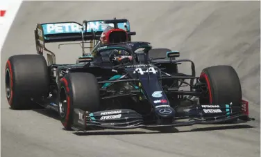  ?? Reuters ?? ↑ Lewis Hamilton steers his car during the second practice session of the Spanish F1 Grand Prix at the Circuit de Catalunya in Montmelo on Friday.