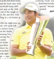  ?? PHOTO BY HARRY HOW/AFP ?? CHAMP
Hideki Matsuyama of Japan poses for a photo with the trophy after putting in to win on the 18th green during the final round of The Genesis Invitation­al at Riviera Country Club on Sunday, Feb. 18, 2024, in Pacific Palisades, California.