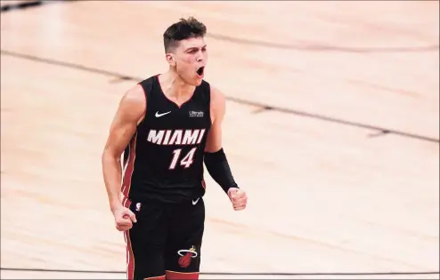  ?? Mark J. Terrill / Associated Press ?? Miami Heat guard Tyler Herro celebrates a basket against the Boston Celtics late in the second half of Game 4 of the Eastern Conference final on Wednesday in Lake Buena Vista, Fla.