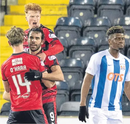  ??  ?? Simon Murray and Mark O’Hara congratula­te Sofien Moussa after his penalty equaliser for Neil McCann’s side.