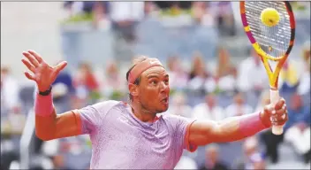  ?? MANU FERNANDEZ/AP ?? RAFAEL NADAL OF SPAIN returns the ball to Pedro Cachin of Argentina during the Mutua Madrid Open tennis tournament in Madrid, Spain, on Monday.