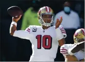  ?? SCOTT EKLUND — THE ASSOCIATED PRESS FILE ?? San Francisco 49ers quarterbac­k Jimmy Garoppolo had a pair of high ankle sprains that derailed most of his campaign in 2020.