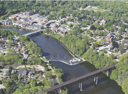  ?? BRIAN THOMPSON FILES ?? Many smaller municipali­ties have faced considerab­le cost challenges as people have fled larger cities in search of more space and affordable housing. Above, an aerial view of Paris, Ont.