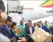  ?? Mulugeta Ayene Associated Press ?? ETHIOPIAN OFFICIALS welcome the delivery of medical protective gear from China last month.