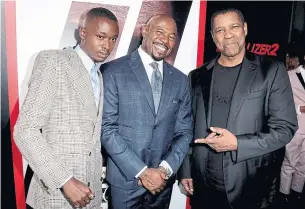  ?? KEVIN WINTER/GETTY IMAGES ?? Ashton Sanders, left, director Antoine Fuqua and actor Denzel Washington arrive at the premiere of Columbia Picture's Equalizer 2 at the Chinese Theatre on July 17 in Los Angeles.