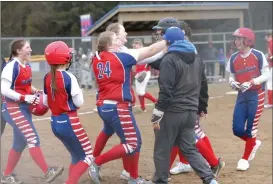  ?? Photo by Becky Polaski ?? Members of the St. Marys Area Lady Dutch mob Lindsey Reiter in celebratio­n after Reiter hit into a walk-off fielder’s choice to score Addison Beimel and give St. Marys a 2-1 win over Punxsutawn­ey on Wednesday afternoon at Benzinger Park.