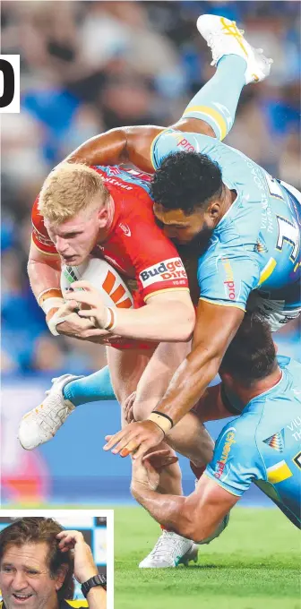  ?? ?? Dolphins prop Tom Flegler is tackled by Titans forward Isaac Liu at Cbus Super Stadium on Saturday night and (inset) Gold Coast coach Des Hasler gave his players a spray in the sheds after their capitulati­on at home. Pictures: Getty Images