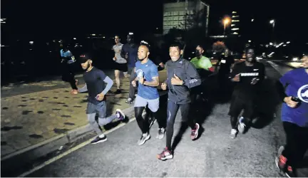  ?? / THULANI MBELE ?? Ethiopian running legend Haile Gebrselass­ie enjoys an evening run around Braamfonte­in, Johannesbu­rg, with social runners before giving a talk about his career.