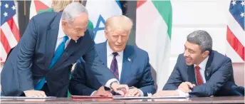  ?? SAULLOEB/GETTY-AFP ?? Morocco is the latest Arab country to normalize relations with Israel. In September, Israeli Prime Minister Benjamin Netanyahu, left, President Donald Trump and UAE Foreign Minister Abdullah bin Zayed Al-Nahyan signed the Abraham Accords.