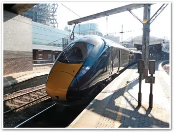  ?? RICHARD CLINNICK. ?? At London Paddington on May 21, Great Western Railway 800034 waits to leave with the 1015 to Cardiff Central. Platforms at the London terminus were extended to be able to accommodat­e the longer trains.