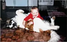  ?? CONTRIBUTE­D ?? Two-year-old Wes Martin plays with his St. Bernard, Heidi. “I’ve always loved dogs,” says Martin, a former standout at Milton-Union High School who now plays for the Washington Redskins.