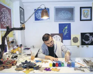  ?? ?? Özçelik decorates dried plane tree leaves at his home, in Uşak, western Turkey, May 25, 2022.