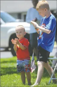  ?? NEWS-SENTINEL PHOTOGRAPH­S BY BEA AHBECK ?? Jordan McComb, 3, and cousin Conner Van Zant, 10, applaud as the city dedicates the new flagpole at Legion Park in Lodi on Flag Day on Friday.