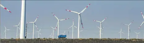  ?? ZHAO GE / XINHUA ?? Wind turbines generate power in Dabancheng district in Urumqi, capital of the Xinjiang Uygur autonomous region.