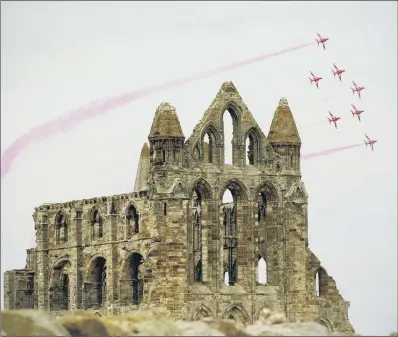  ?? PICTURE: CERI OAKES ?? SHOW OF SKILL: The Red Arrows air display team fly over Whitby Abbey. A campaign is underway to base them in Yorkshire.