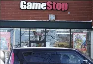  ?? NAM Y. HUH - ASSOCIATED PRESS ?? A vehicle passes in front of a GameStop store in Vernon Hills, Ill., on Thursday.