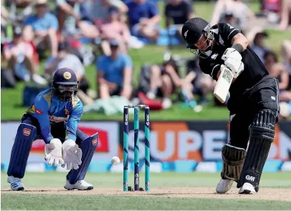  ?? AFP ?? Ross Taylor (right) top-scored with 137 to lift New Zealand to 364 for four against Sri Lanka on Tuesday. —