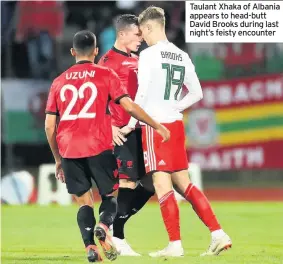  ??  ?? Taulant Xhaka of Albania appears to head-butt David Brooks during last night’s feisty encounter