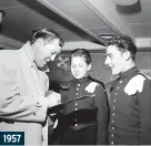  ??  ?? 1957
Shake, rattle and sign: American rock and roll star Bill Haley signed autographs for railway staff at Waterloo. The Rock around the Clock singer was on his first visit to England.