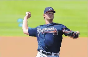  ?? BRYNN ANDERSON/ASSOCIATED PRESS ?? Atlanta’s Mike Soroka throws during a practice on Friday. The organizati­on has said it is comfortabl­e retaining the Braves nickname going forward.