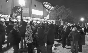  ?? John Lucas/ Edmonton Journal ?? Fans wait outside Rexall Place before Paul McCartney’s Nov. 28 concert. It was the first of two performanc­es; tickets sold out in a matter of minutes for both shows.