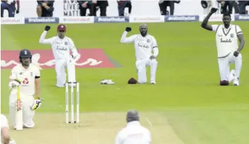  ?? Forster/getty Images for ECB) (Photo: Stu ?? (From second left) Shane Dowrich, Jermaine Blackwood and Jason Holder of the West Indies take a knee during day one of the 1st #Raisetheba­t Test match at The Ageas Bowl in Southampto­n, England, in this July 8, 2020 file photo.