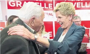  ?? NATHAN DENETTE/THE CANADIAN PRESS ?? Ontario Liberal Leader Kathleen Wynne meets a supporter while campaignin­g in Thunder Bay.