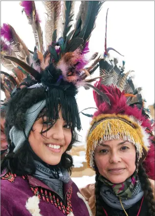  ?? ?? LEFT: Corina and her daughter. RIGHT: History through Indigenous eyes. BELOW: Corina dances in the film.